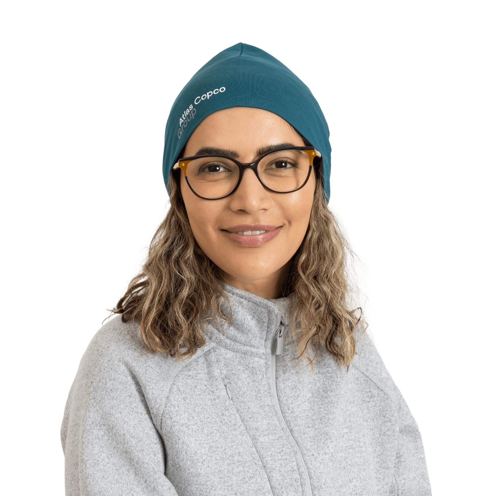 woman wearing teal beanie with atlas copco group logo