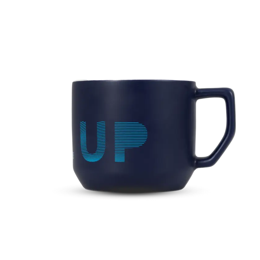 blue cheramic mug with atlas copco logo and text level up back