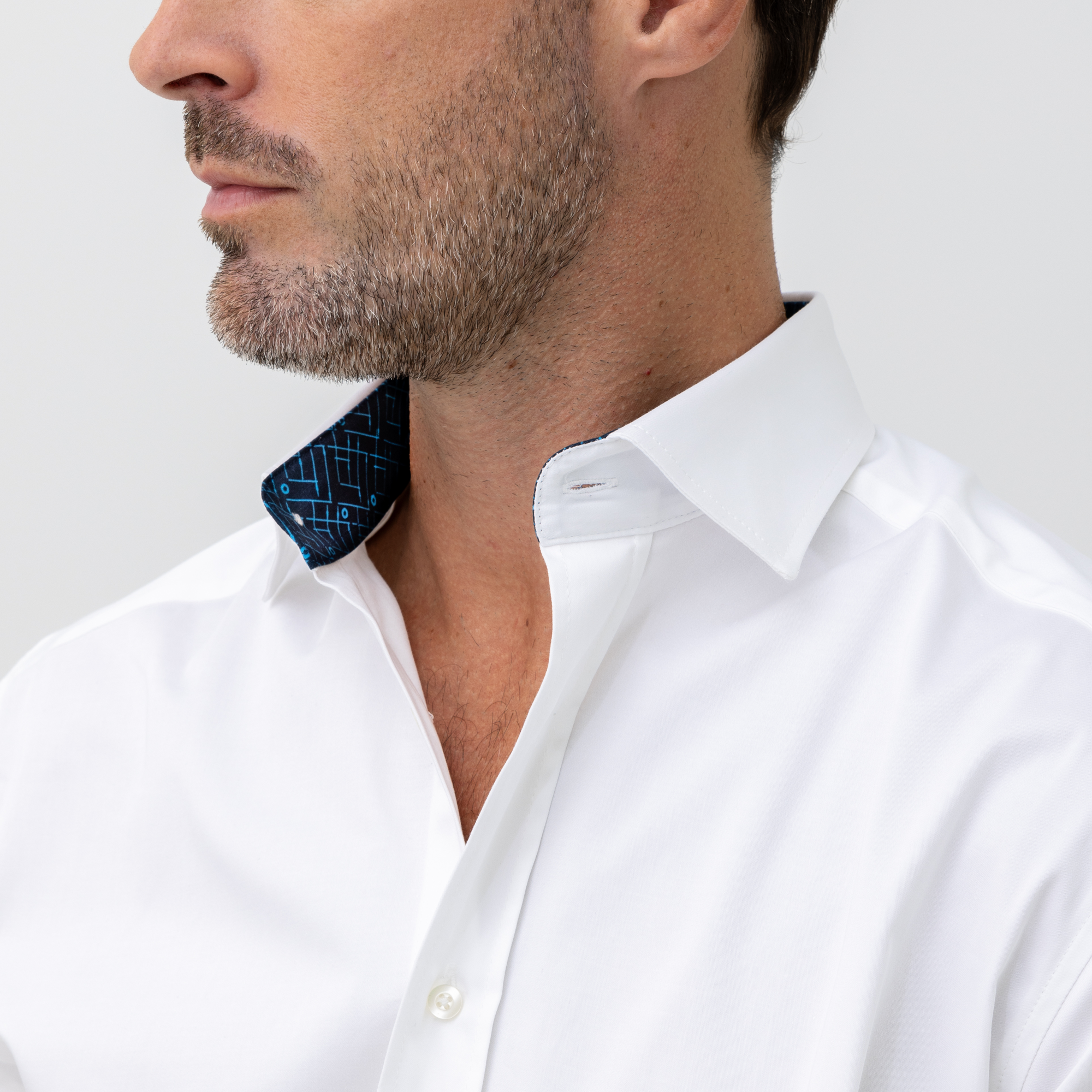 white business shirt with logo on sleeves